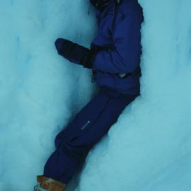 Sally White exiting Erebus Glacier Tongue ice caves entrance