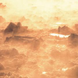 Early morning sea mist over broken ice