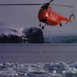 US Navy helicopter over Borradaile Island, Balleny Group