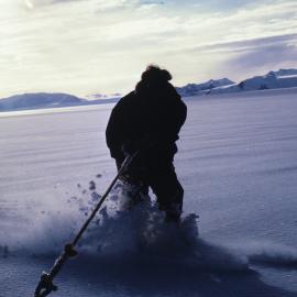 Skiing behind toboggan