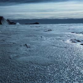 Ice Crystals Forming on Glare Ice of Plateau Surface with Side of Mount Shapeless