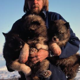 Bill Eaton with Three Husky Pups