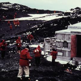 Tourists from World Discoverer Visit Shackleton's Hut at Cape Royds