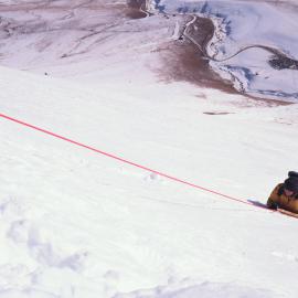 Surveyor Hanging Above Car Park and Ski Field