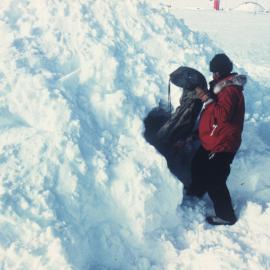 Removing equipment whilst building snow mound 
