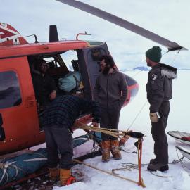 Kiwi Field Assistants loading Helicopter