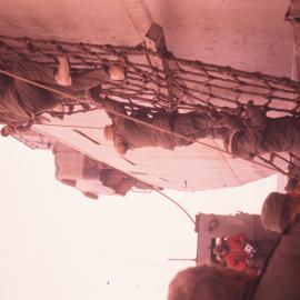 Climbing a Boarding Net onto the USS 'Arneb'