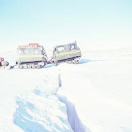 H16 Hägglunds cargo train crossing a crack in the sea ice