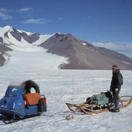 Tony Oliver checks toboggan & Jack McConchie beside sledge 