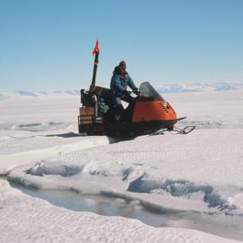 Skidoo Goes over Sea-Ice Crack