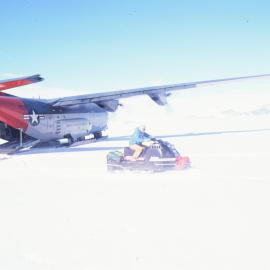 Ray Waters drives a skidoo from the rear of a Hercules