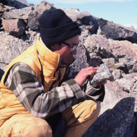 Chinese guest scientist, Zhang Fu Yuan examines  rock specimens at Robertson Ridge