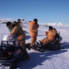 Governor-General Sir David Beattie riding a sled behind a Yamaha toboggan