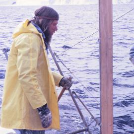 J Lowry taking samples from the sea floor at Cape Bird