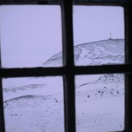 View of Vince's Cross from interior of Discovery Hut