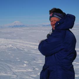 Colin Fox (K131) flying a kite, Mt Discovery in the background