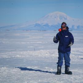 Colin Fox (K131) playing ball, Mt Discovery in the background