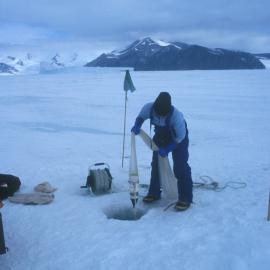 Pulling up a plankton sampling net through a sea ice hole near the LGP camp