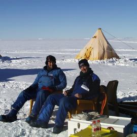 Gathering seismic survey data from a lab set up in the rear cab of a Hagglunds tracked vehicle
