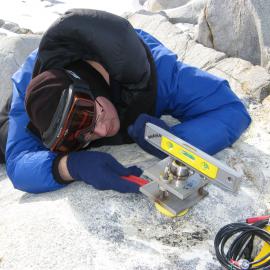 Nic Donnelly setting up antenna mount for the GPS at Cape Roberts
