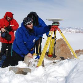 Seth White & Aaron Jordan & Nic Donnelly (obscured) setting up the GPS at Mt England