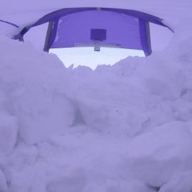View from inside blue / lilac tent full of snow