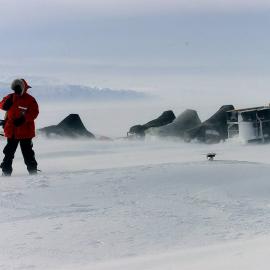 A scientist returning after checking skidoos in a storm