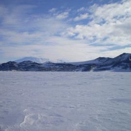 Ross Island from the sea ice with McMurdo Station, Observation Hill and Mt Erebus in the distance