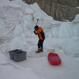 Collecting ice for water for the camp at Granite Harbour