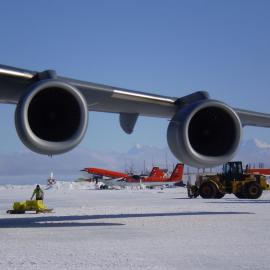 Basler, Twin Otter, vehicles viewed under the engines of C17 at the ice runway