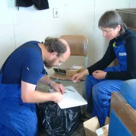 Bev Dickson and Craig Marshall taking fin clips in fish hut off Cape Armitage