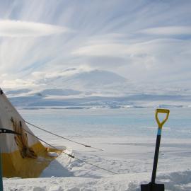 Polar tent, shovel and Mt Erebus, from Hutton Cliffs
