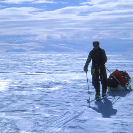 Eric on the Ross Ice Shelf, Transantarctic Mountains in the background.