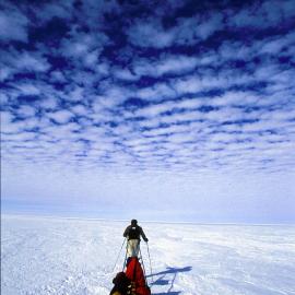 Jon Muir strides south under a mottled sky