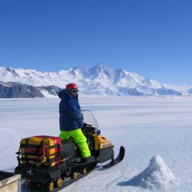 Kathy Ruggiero driving a skidoo home from the plankton hole