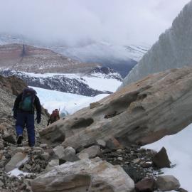 Dr James White from University of Otago walks past an ancient lava flow