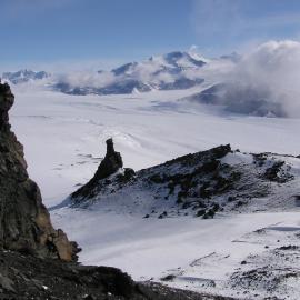 Eroded column of volcanic sediments and Koettlitz Glacier