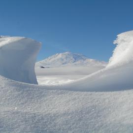 Mt Erebus through a snow formation