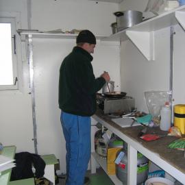 Cooking dinner in the kitchen hut, Bratina Island
