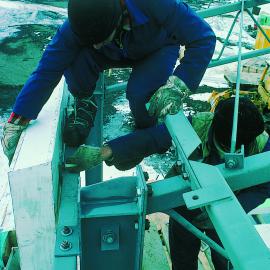 Scott Base: bolting on wall panels of Command Centre