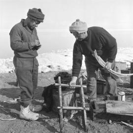 Listing historic articles found in hut: Baden Norris on left and team leader Eric Gibbs