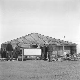 NZ Antarctic Society Hut's Restoration Party with historic places plaque