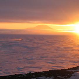 Hagglund heading away from Scott Base as the sunsets in late October