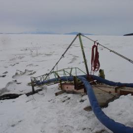 Showing sea level cable going through ice into sea