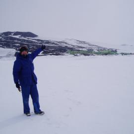 Composer Gareth Farr on the sea ice in front of Scott Base