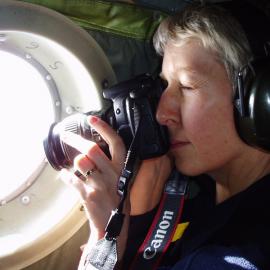 Megan in the Hercules on the way to Antarctica taking a photo of the first signs of sea ice