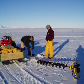 Andrew Martin and Simon Davy drilling a hole through the sea ice (coring)