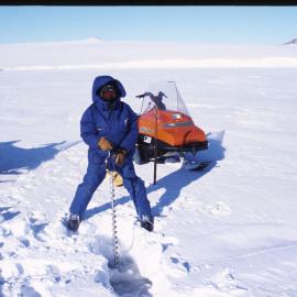 Scott Base Summer staff: Kevin Nicholas drilling sea ice near Turtle Rock
