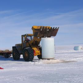 Italian loader removing ice plug from plankton hole.
