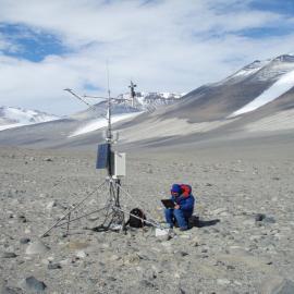 Data from the Bull Pass soil climate station being downloaded by Cathy Seybold.